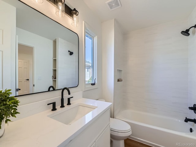 full bath with toilet, visible vents, shower / washtub combination, and vanity