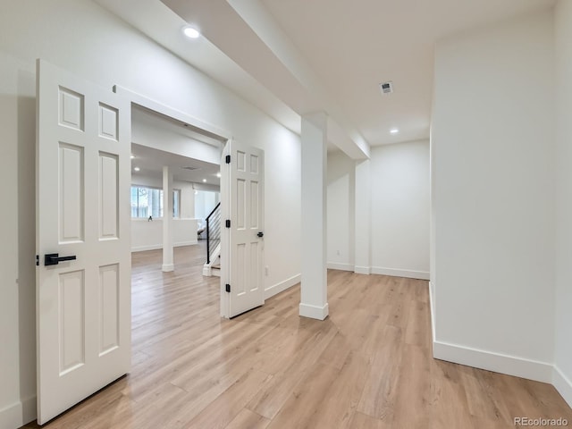 interior space featuring recessed lighting, visible vents, light wood-style flooring, and baseboards