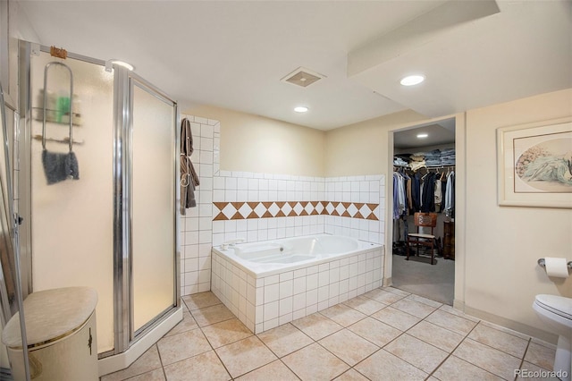 full bath with tile patterned flooring, visible vents, toilet, a garden tub, and a stall shower