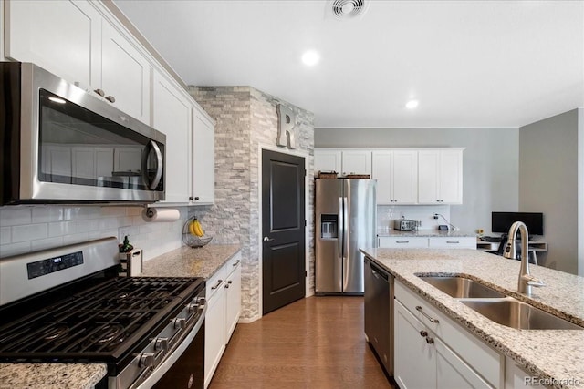 kitchen featuring visible vents, white cabinetry, a sink, dark wood finished floors, and appliances with stainless steel finishes