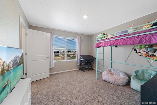 carpeted bedroom with baseboards