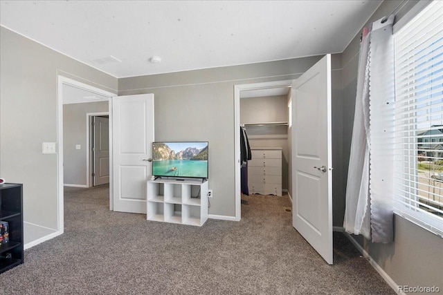 unfurnished bedroom featuring baseboards and carpet flooring