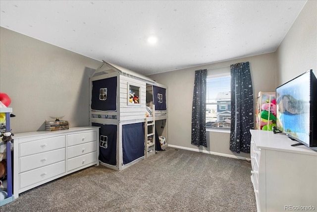 bedroom with baseboards and carpet