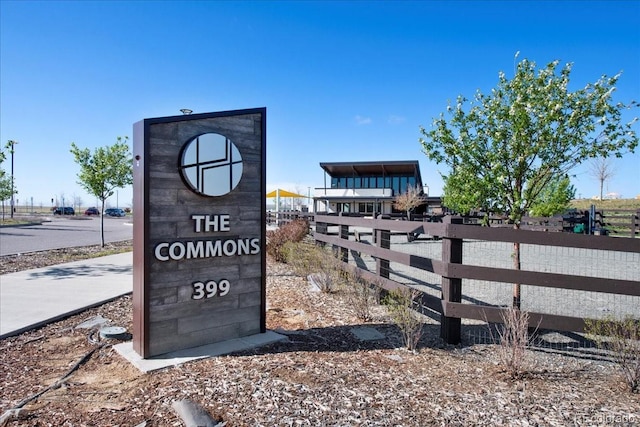 community sign featuring fence