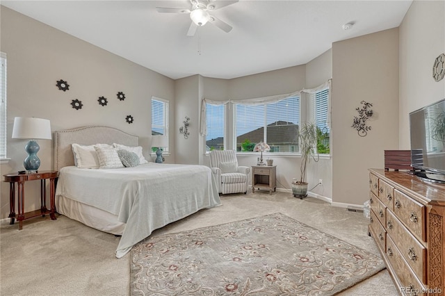 2932 Eagle Wing Way, Castle Rock, CO 80109 - bedroom with light carpet, baseboards, and a ceiling fan