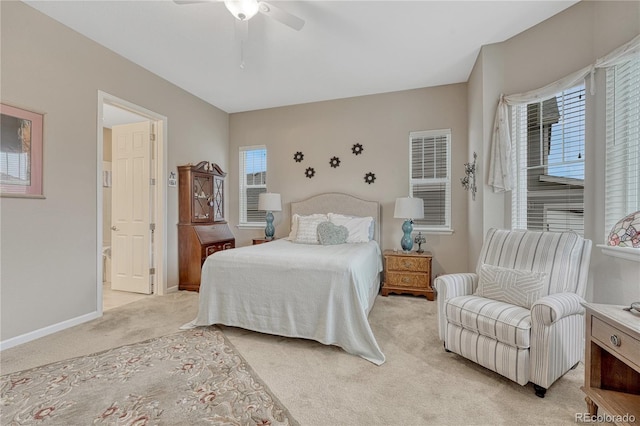 2932 Eagle Wing Way, Castle Rock, CO 80109 - bedroom with light colored carpet, baseboards, a ceiling fan, and connected bathroom