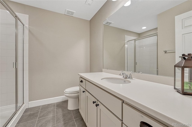 2932 Eagle Wing Way, Castle Rock, CO 80109 - bathroom featuring toilet, a stall shower, vanity, tile patterned flooring, and baseboards