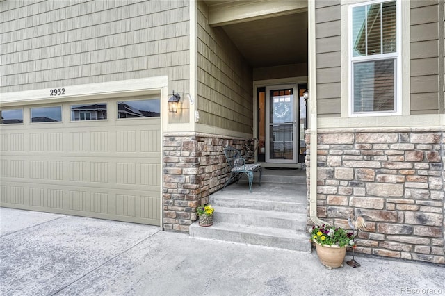 2932 Eagle Wing Way, Castle Rock, CO 80109 - view of exterior entry with stone siding and a garage