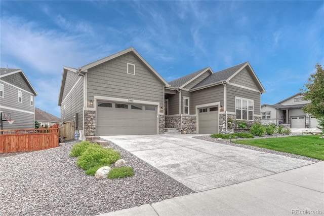 2932 Eagle Wing Way, Castle Rock, CO 80109 - view of front of property with an attached garage, stone siding, and driveway