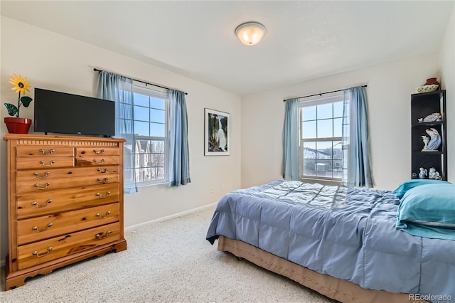 bedroom featuring multiple windows