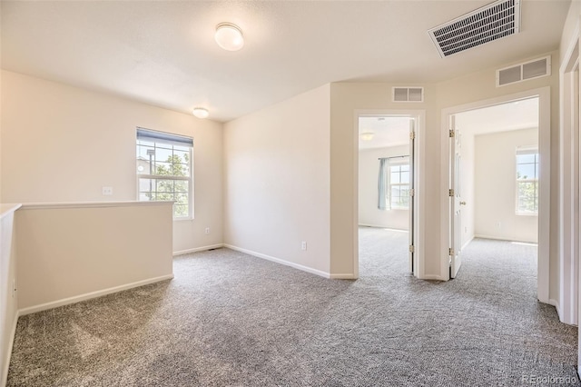 12704 Jasmine St Unit E, Thornton, CO 80602 - spare room with carpet and healthy amount of natural light