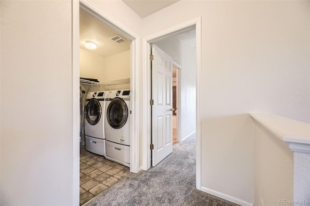 12704 Jasmine St Unit E, Thornton, CO 80602 - washroom featuring washing machine and clothes dryer, stone finish floors, and carpet flooring
