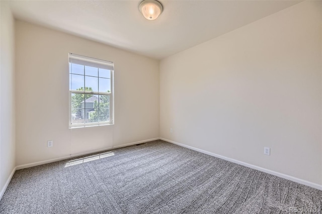 12704 Jasmine St Unit E, Thornton, CO 80602 - empty room with carpet flooring and baseboards