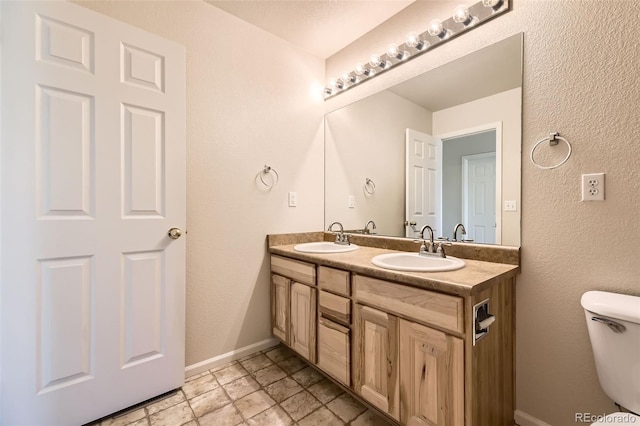 12704 Jasmine St Unit E, Thornton, CO 80602 - bathroom featuring double vanity and toilet