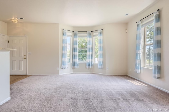 12704 Jasmine St Unit E, Thornton, CO 80602 - carpeted spare room featuring baseboards