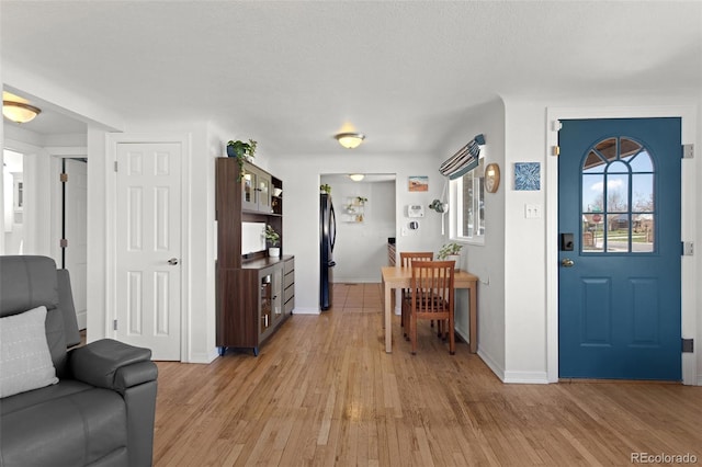 3300 Oneida St, Denver, CO 80207 - entrance foyer featuring baseboards and light wood finished floors