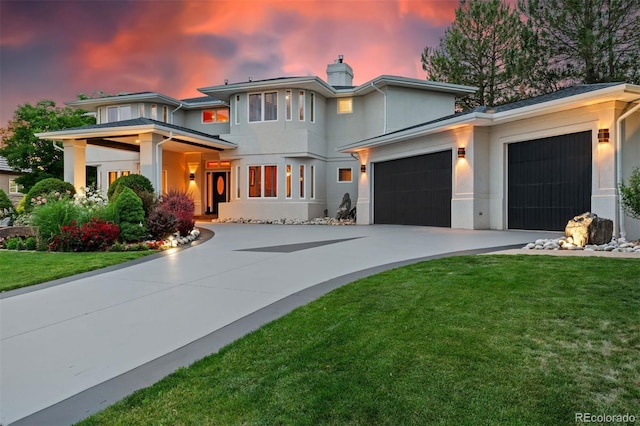 7 Sandpiper Cir, Thornton, CO 80241 - prairie-style home featuring stucco siding, a garage, a chimney, driveway, and a lawn