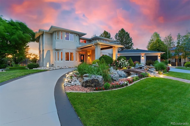 7 Sandpiper Cir, Thornton, CO 80241 - view of front facade with a front yard, concrete driveway, stucco siding, and an attached garage