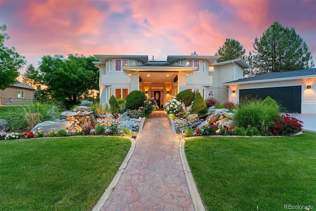 7 Sandpiper Cir, Thornton, CO 80241 - view of front of house featuring stucco siding, a lawn, and a garage