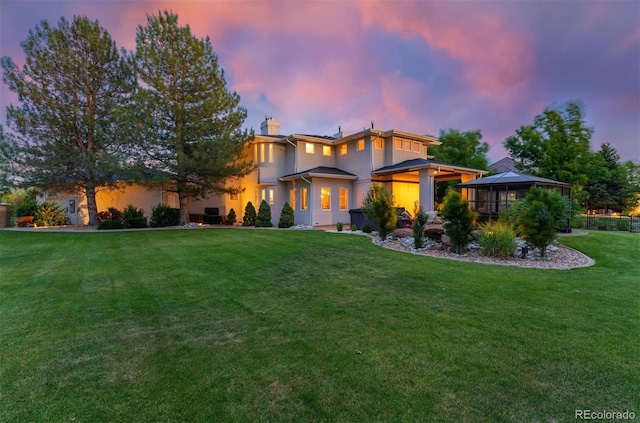 7 Sandpiper Cir, Thornton, CO 80241 - view of front of house with a front yard, a chimney, and a gazebo