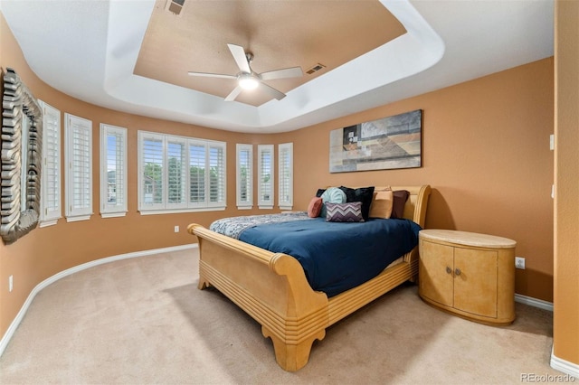7 Sandpiper Cir, Thornton, CO 80241 - bedroom featuring light carpet, a tray ceiling, and a ceiling fan