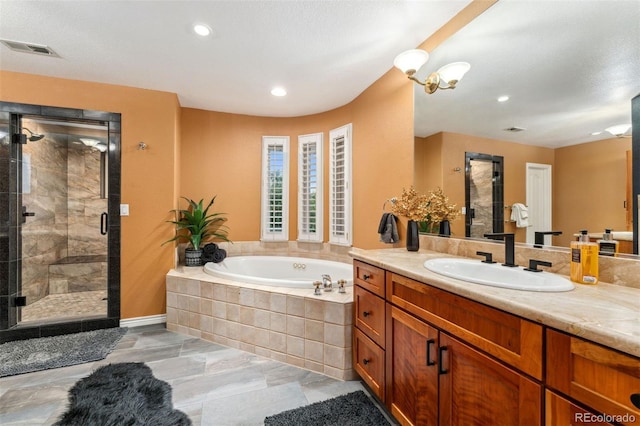 7 Sandpiper Cir, Thornton, CO 80241 - bathroom with vanity, a bath, a stall shower, and recessed lighting