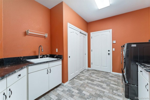 7 Sandpiper Cir, Thornton, CO 80241 - kitchen featuring white cabinets and brick patterned flooring