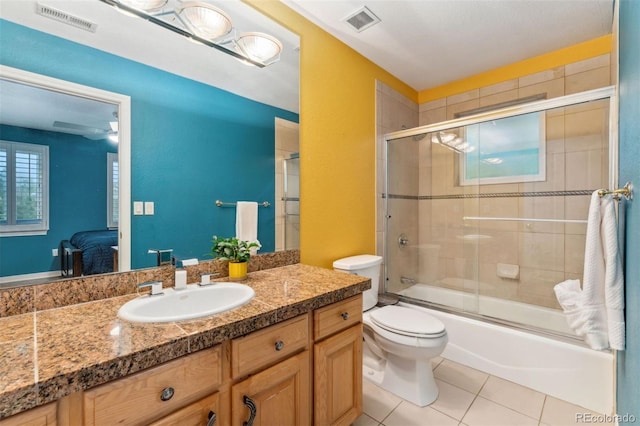 7 Sandpiper Cir, Thornton, CO 80241 - bathroom featuring vanity, combined bath / shower with glass door, and tile patterned floors