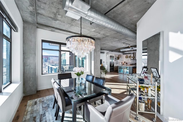 dining area with a chandelier and wood-type flooring