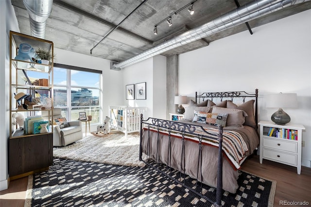 bedroom with hardwood / wood-style floors