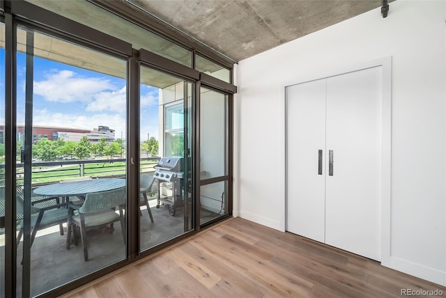 interior space with hardwood / wood-style flooring