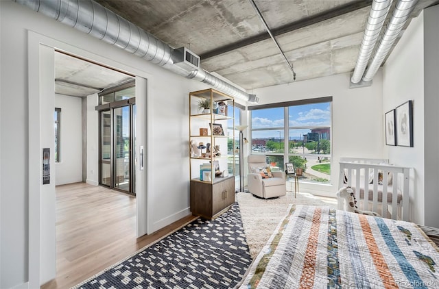 bedroom with light hardwood / wood-style flooring