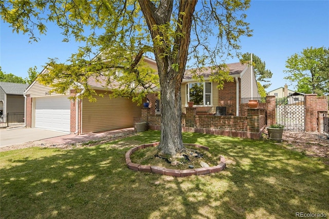5419 E 113th Ave, Thornton, CO 80233 - view of front of house with brick siding, driveway, and a garage
