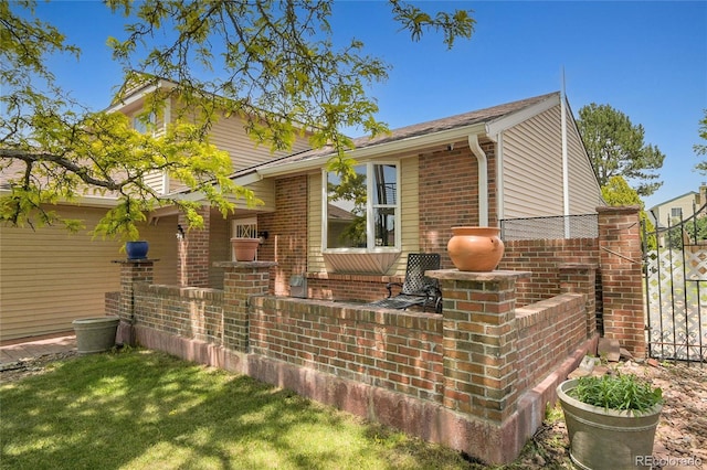 5419 E 113th Ave, Thornton, CO 80233 - view of home's exterior with brick siding