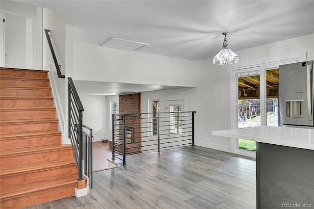 5419 E 113th Ave, Thornton, CO 80233 - unfurnished living room featuring wood finished floors and baseboards