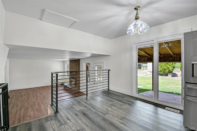5419 E 113th Ave, Thornton, CO 80233 - unfurnished room with wood finished floors, baseboards, and a chandelier