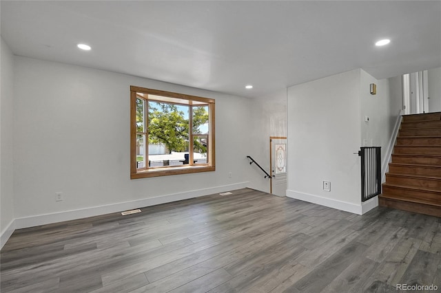5419 E 113th Ave, Thornton, CO 80233 - empty room featuring wood finished floors, baseboards, recessed lighting, and stairs