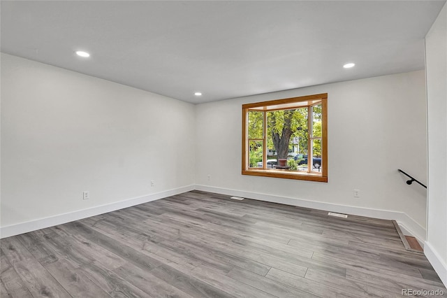 5419 E 113th Ave, Thornton, CO 80233 - spare room with wood finished floors, baseboards, and recessed lighting