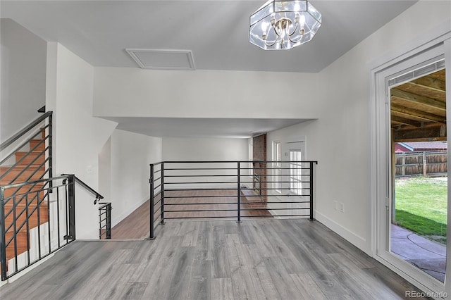 5419 E 113th Ave, Thornton, CO 80233 - interior space featuring wood finished floors, baseboards, and a chandelier
