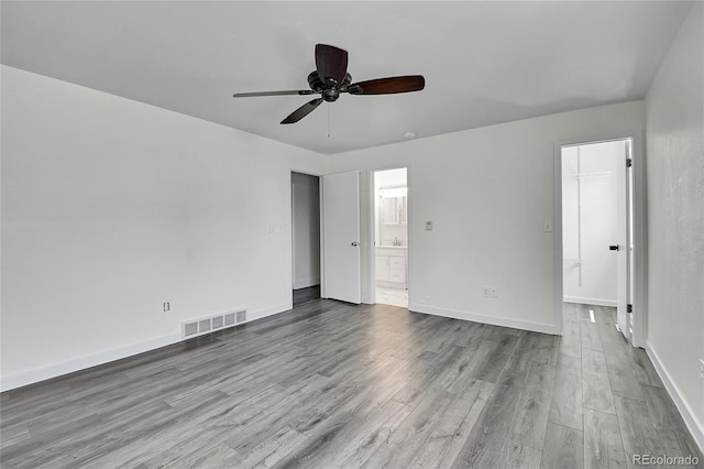 5419 E 113th Ave, Thornton, CO 80233 - spare room with wood finished floors, ceiling fan, and baseboards