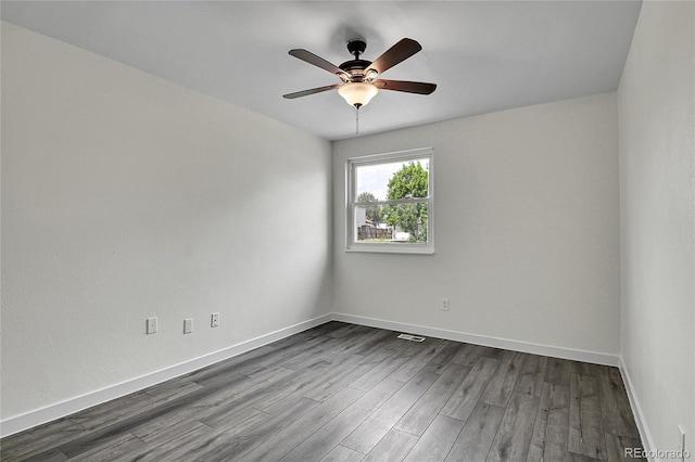 5419 E 113th Ave, Thornton, CO 80233 - unfurnished room with dark wood finished floors, a ceiling fan, and baseboards