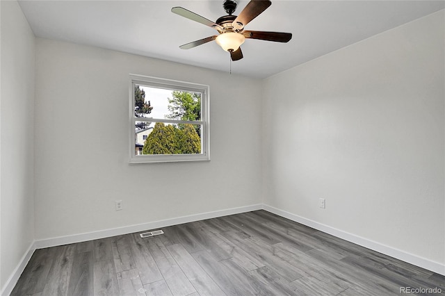 5419 E 113th Ave, Thornton, CO 80233 - unfurnished room with baseboards, dark wood-type flooring, and ceiling fan