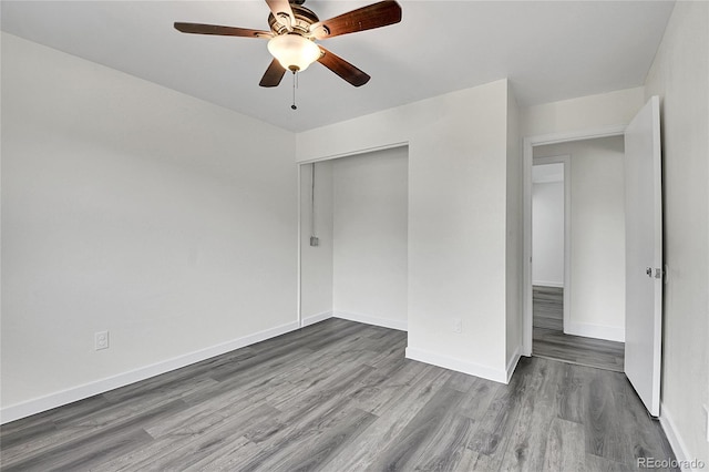 5419 E 113th Ave, Thornton, CO 80233 - unfurnished bedroom with wood finished floors, a closet, baseboards, and a ceiling fan