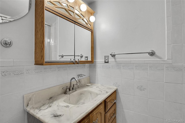 5419 E 113th Ave, Thornton, CO 80233 - bathroom with vanity, tile walls, and wainscoting