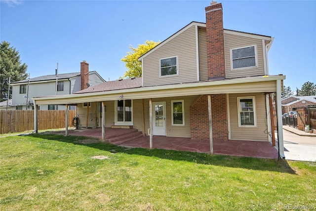 5419 E 113th Ave, Thornton, CO 80233 - rear view of house with a patio and a chimney