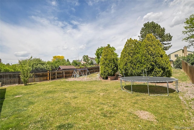 5419 E 113th Ave, Thornton, CO 80233 - view of yard featuring a trampoline and a playground