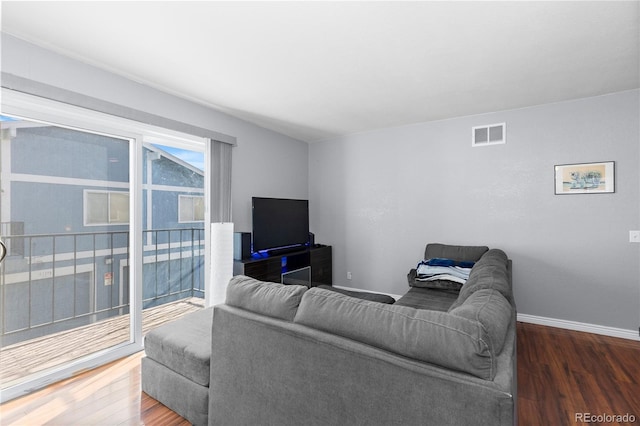 living room with dark hardwood / wood-style flooring