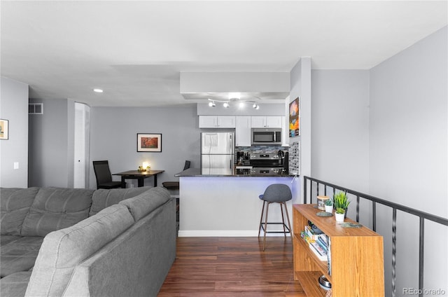 living room with dark wood-type flooring