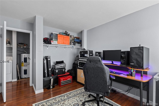 home office featuring washer / dryer, water heater, and hardwood / wood-style flooring