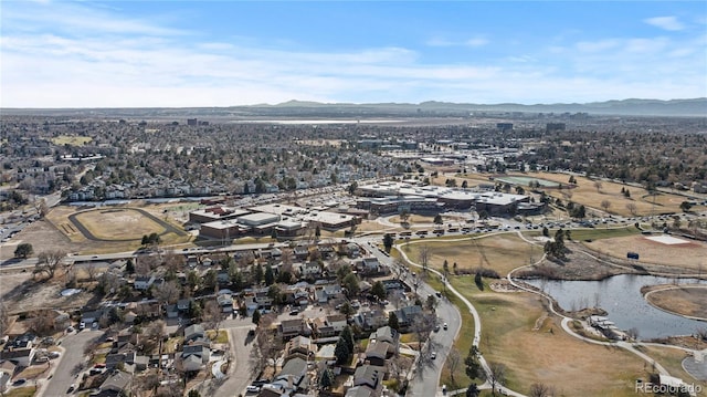 drone / aerial view with a water and mountain view